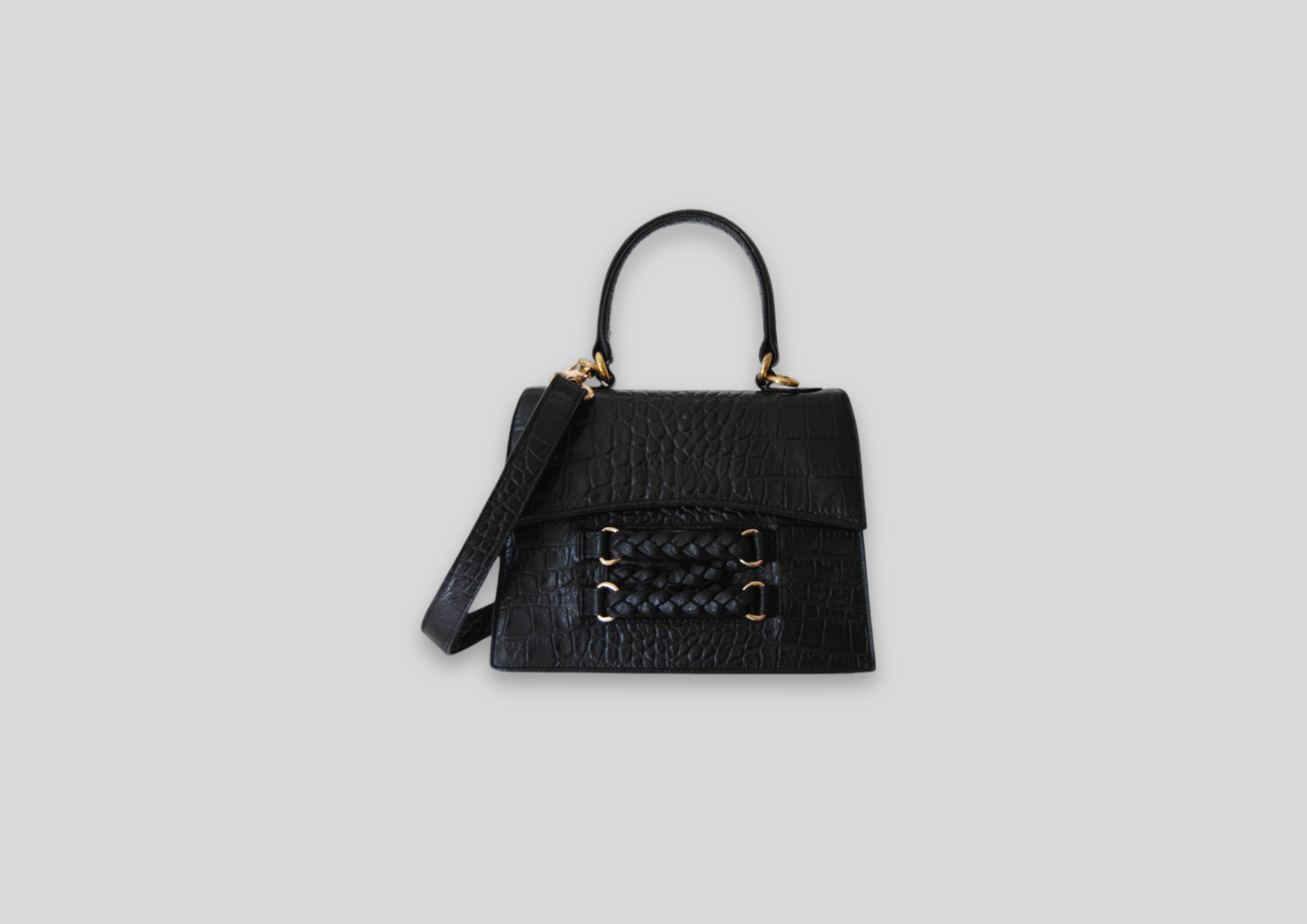 Elegant black Amani bag with braided detail and removable strap, perfect for luxury handbag lovers.