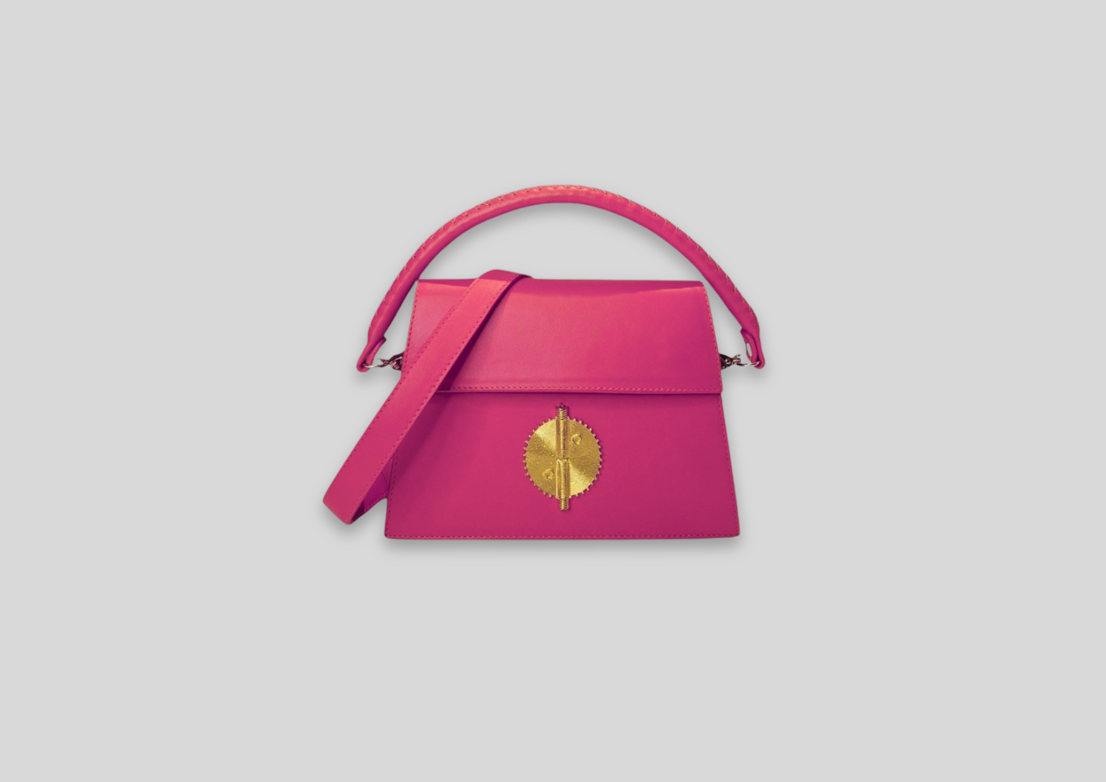 Malaika Bag in vibrant pink with elegant gold detailing, perfect for luxury fashion and special occasions.