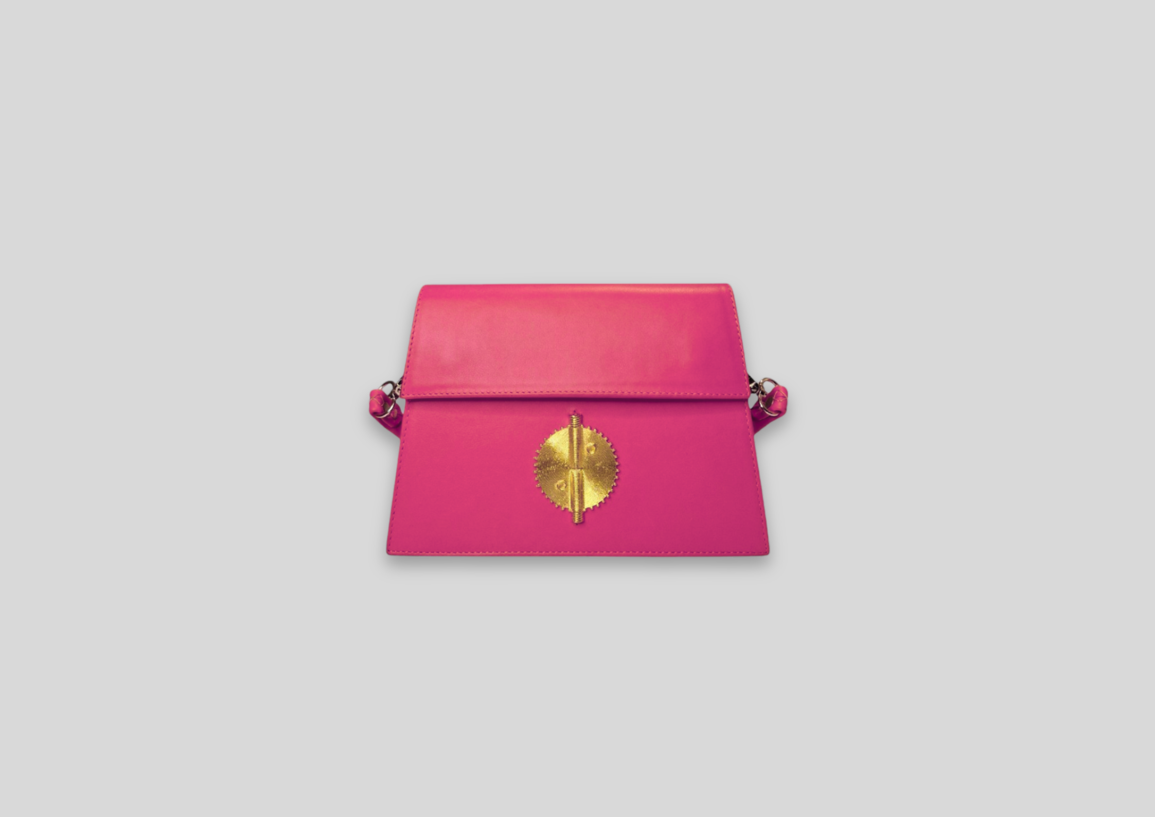 Pink luxury handbag with gold emblem, stylish design for elegant occasions and everyday use.